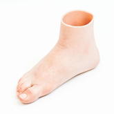 Silicone foot prosthesis with a white skin tone