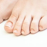 Close up of toes on Silicone foot prosthesis with a white skin tone