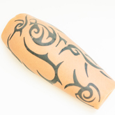 Silicone prosthesis forearm cover with a black lines pattern tattoo and a white skin tone