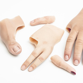 Partial silicone hand and digit prostheses with a white skin tone