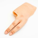 Close up of a white skin tone partial silicone hand with little and ring fingers